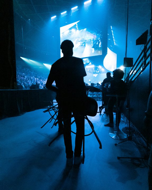 Man walking into a concert arena