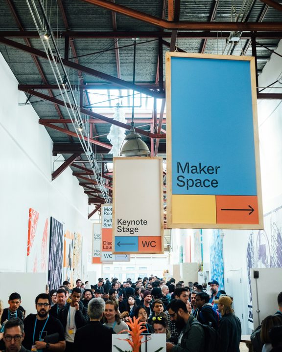 Crowded hallway during an art conference